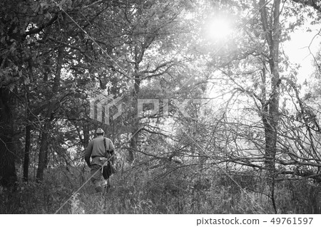 Re-enactor Dressed As World War II Russian Soviet Red Army Soldier Walking With Weapon Through Re-enactor Dressed As World War II Russian Soviet Red Army Soldier Walking With Weapon Through 49761597