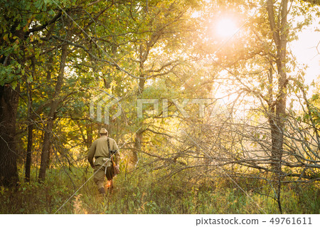 Re-enactor Dressed As World War II Russian Soviet Red Army Soldier Walking With Weapon Through Re-enactor Dressed As World War II Russian Soviet Red Army Soldier Walking With Weapon Through 49761611