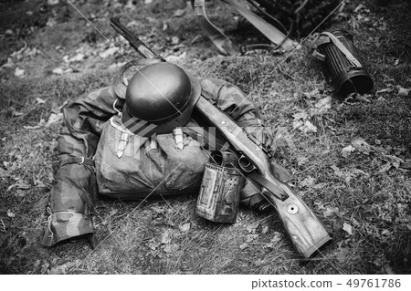 World War II German Wehrmacht Soldier Ammunition Of World War II On Ground. WWII Military Helmet 49761786