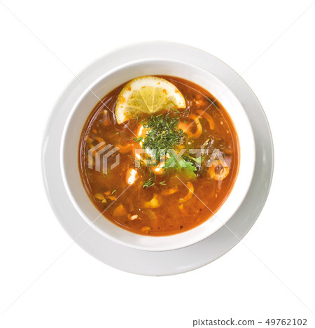 Solyanka soup in the plate, isolated on white background. Top view 49762102