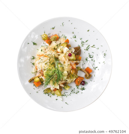 Plate with potato salad on a table. Top view 49762104