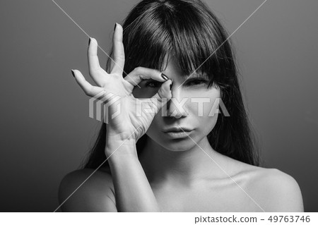 sceptic strict watchful emotion girl portrait 49763746