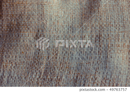 Old and dust plastic woven sack background 49763757
