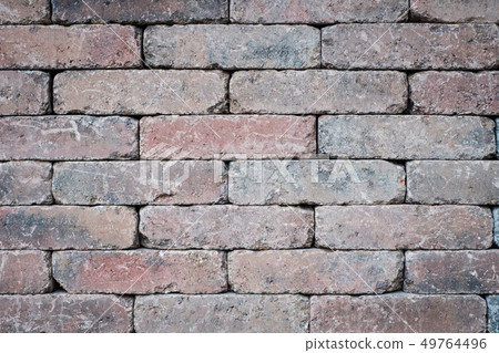 old brick wall closeup - tiled stone background 49764496