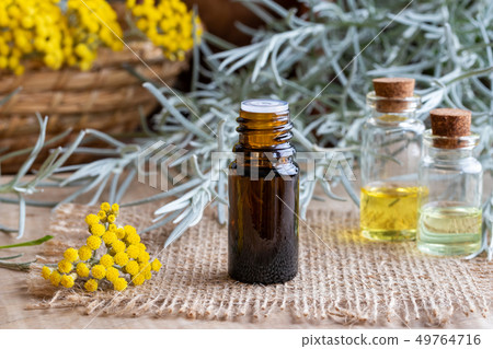 A bottle of helichrysum essential oil  49764716