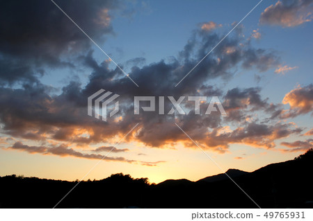Glow sky and mountain silhouette 49765931