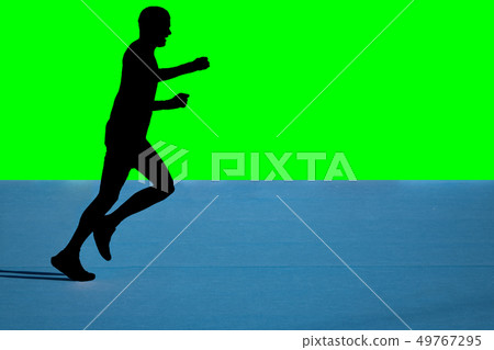 Fast marathon runner silhouette with green background 49767295