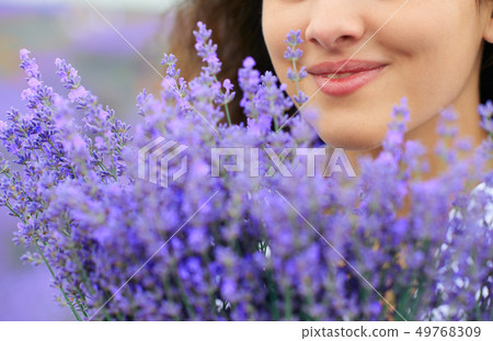 beautiful woman face with lavender flower 49768309