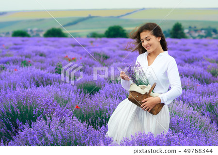young woman is in the lavender flower field, 49768344