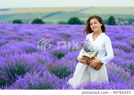 young woman is in the lavender flower field, 49768345