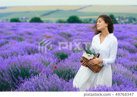young woman is in the lavender flower field, 49768347