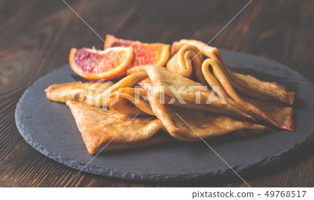 Crepes Suzette on the stone board Crepes Suzette on the stone board 49768517