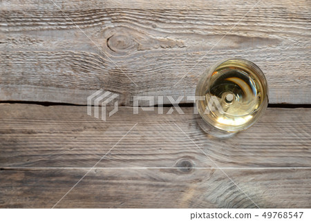 Glass of white wine 49768547