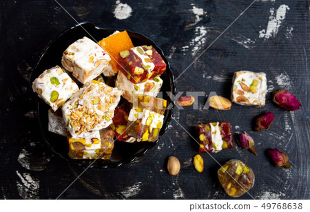 Turkish delights with pistachios and rose flower Turkish delights with pistachios and rose flower 49768638