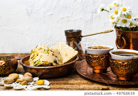 Halva with pistachio served with coffee 49768639