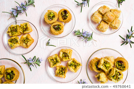 Various Arabic desserts on plates 49768641