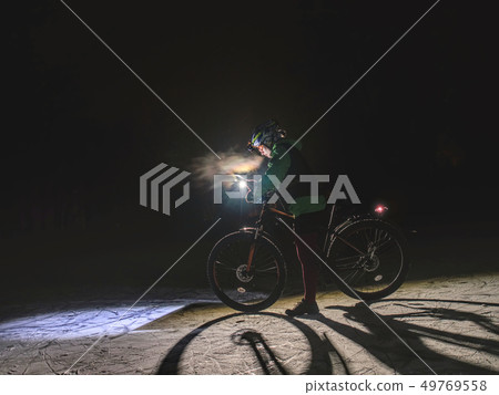 MTB race on large tire wheels in fresh snow 49769558