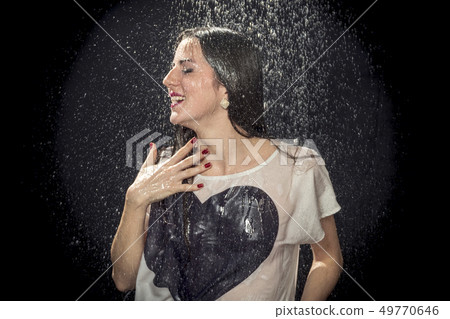 woman is wet in the rain 49770646