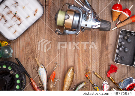 Accesories for fishing on wooden background with copyspace. 49775984