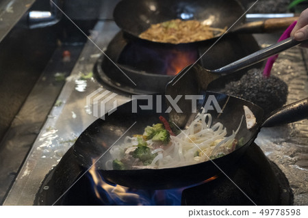 wok rice spaghetti cooking 49778598