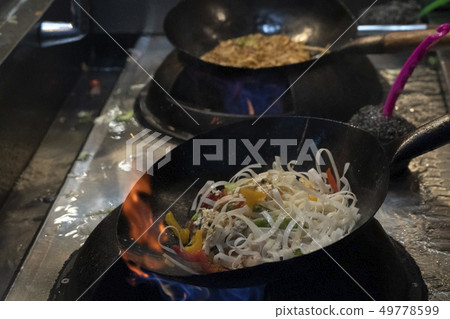 wok rice spaghetti cooking 49778599