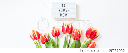 Mothers Day greeting card with red tulip flowers Mothers Day greeting card with red tulip flowers 49779032