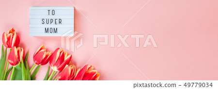 Mothers Day greeting card with red tulip flowers Mothers Day greeting card with red tulip flowers 49779034