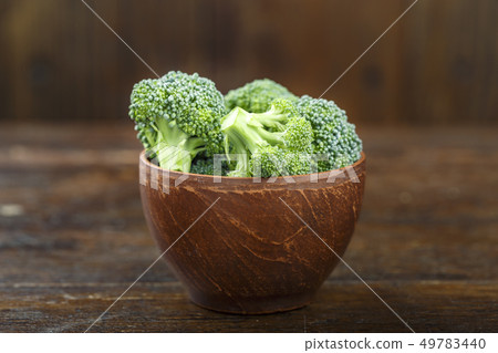 broccoli on wooden background broccoli on wooden background 49783440
