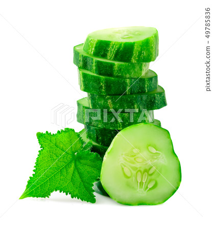A stack of green cucumber slices with leaves on a A stack of green cucumber slices with leaves on a 49785836
