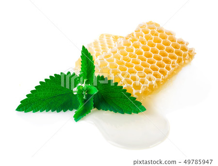 Honey with mint on a white background. 49785947