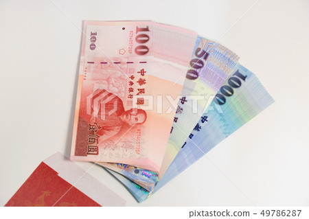 Red envelope packet with Taiwan money. 49786287