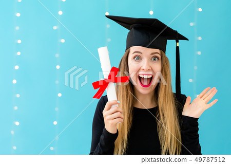 Young woman with a graduation diploma Young woman with a graduation diploma 49787512