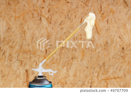 Spray can with foam which is used in construction. 49787709