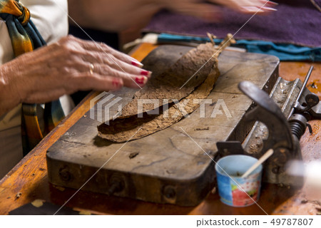 Woman making cigar - Trinidad - Cuba Woman making cigar - Trinidad - Cuba 49787807