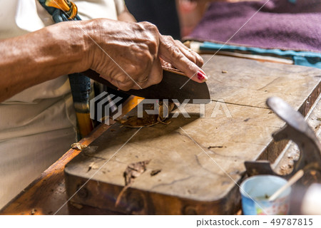 Woman making cigar - Trinidad - Cuba Woman making cigar - Trinidad - Cuba 49787815