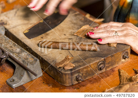 Woman making cigar - Trinidad - Cuba Woman making cigar - Trinidad - Cuba 49787820