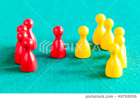 few red pawns in front of several yellow pawns 49788936