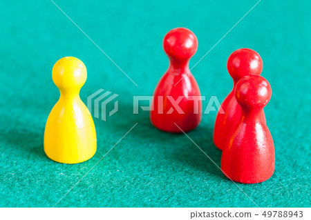 one yellow pawn in front of three red pawns 49788943