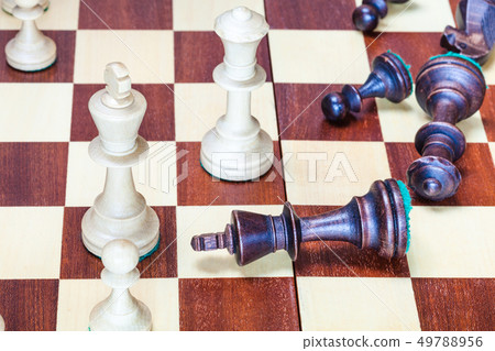 falling black chess pieces and white chessmen falling black chess pieces and white chessmen 49788956