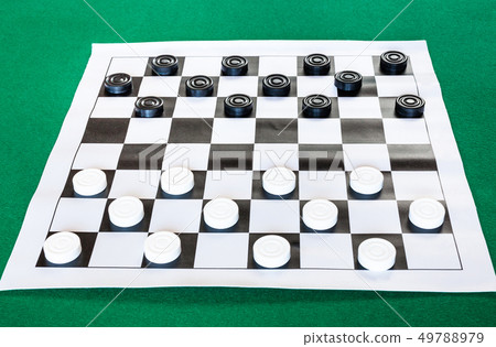 draughts on black and white checkered sheet board draughts on black and white checkered sheet board 49788979