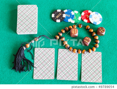 card decks, dices, casino tokens and worry beads 49789054