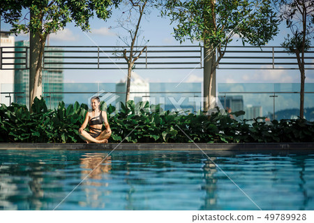 Sexy slim caucasian brunette meditation between 49789928