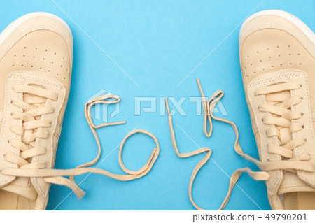 Women sneakers with laces in folk text. Women sneakers with laces in folk text. 49790201