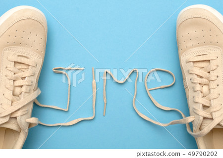 Women sneakers with laces in time text. Women sneakers with laces in time text. 49790202