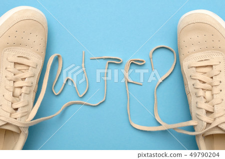 Women sneakers with laces in wtf text. Women sneakers with laces in wtf text. 49790204