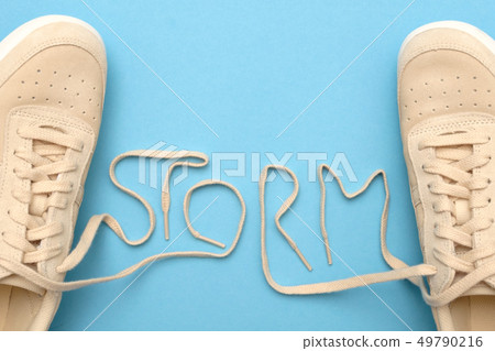 Women sneakers with laces in storm text. 49790216