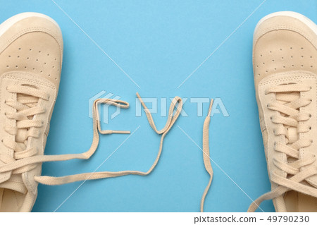 Women sneakers with laces in fyi text. For your information. 49790230