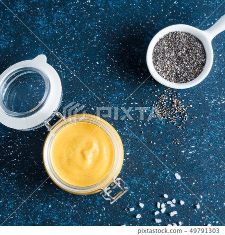 Vegan creamy cheddar cheese sauce with chia seeds Vegan creamy cheddar cheese sauce with chia seeds 49791303