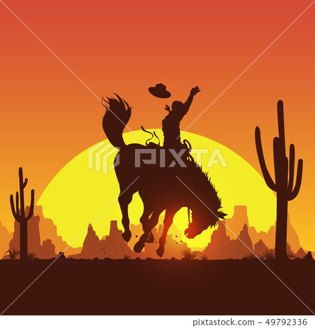 Silhouette of a cowboy riding a wild horse 49792336