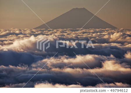 Clouds of the dawn seen from Yatsugatake mountain range and the front three heads and Mt. Fuji 49794612